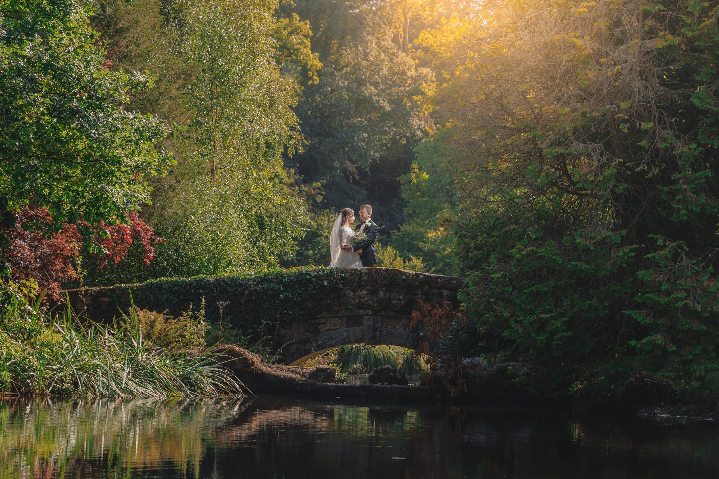 Louise + Amjad | Bovey Castle Micro Wedding, Dartmoor 29 Louise and Amjad Bovey Castle micro wedding photography — couple portraits on the bridge