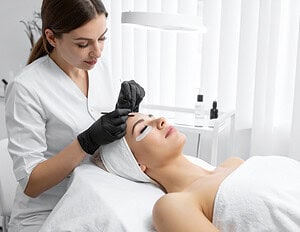 -Licensed-Dermatologist-Performing-Facial-Skin-Treatment