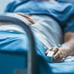 Hospitals, healthcare, medical, patient care, nurse, doctor, hospital bed, healthcare facility, emergency room, medical staff, patient in hospital bed, medical equipment, hospital setting, health services, patient treatment, healthcare professionals.
