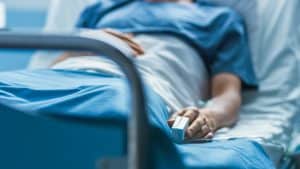 Hospitals, healthcare, medical, patient care, nurse, doctor, hospital bed, healthcare facility, emergency room, medical staff, patient in hospital bed, medical equipment, hospital setting, health services, patient treatment, healthcare professionals.