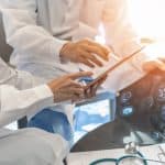 Radiologists and medical professionals analyzing brain MRI scans for medical diagnosis and treatment planning.