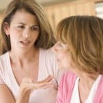 Advice-giving woman counseling an older woman, demonstrating legal support and guidance for family law and estate planning services.
