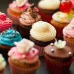 Cupcakes with colorful frosting and sprinkles, celebration desserts, sweet treats, party baked goods, festive cupcakes, dessert decoration, tasty baked sweets, colorful cupcake display, celebration cupcakes, delicious frosting cupcakes.