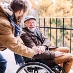 Accessible elderly care assistance for seniors with mobility challenges, highlighting compassionate support and medical aid.