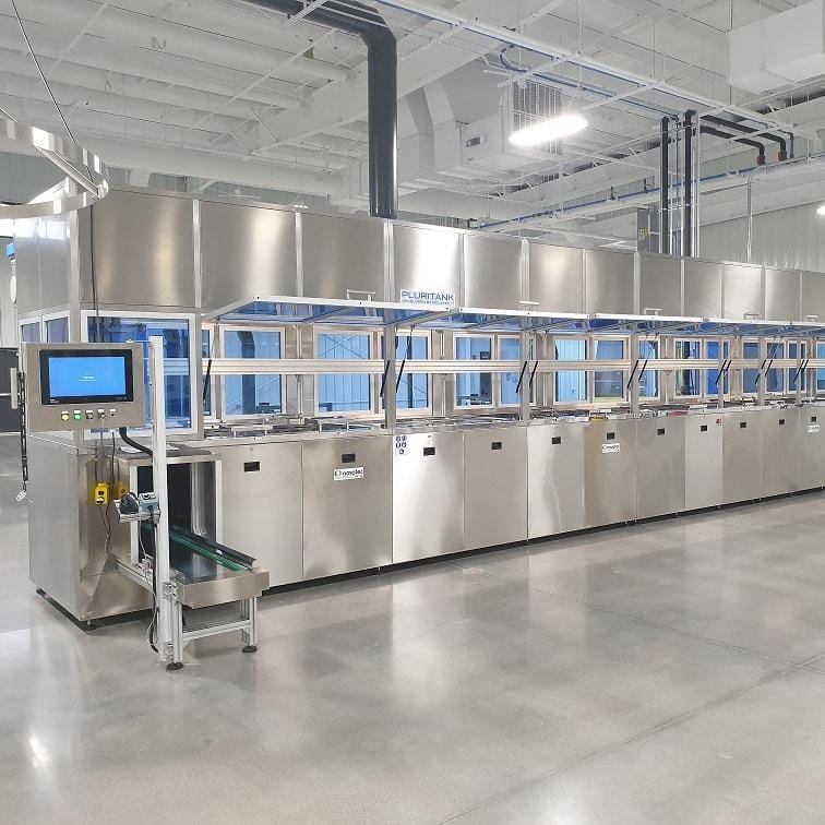 Multi-chamber ultrasonic cleaning system for medical technology