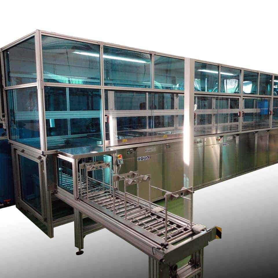 Multi-chamber cleaning system with automatic goods transport