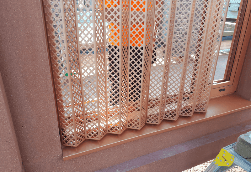 Perforated metal sunscreen and privacy screen