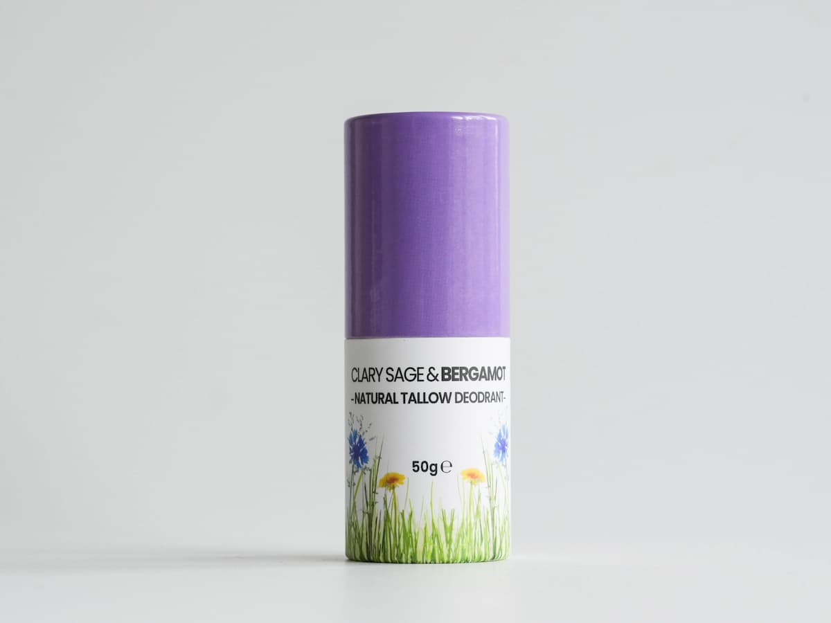 Soft lavender tallow skincare balm in eco-friendly packaging for organic beauty.