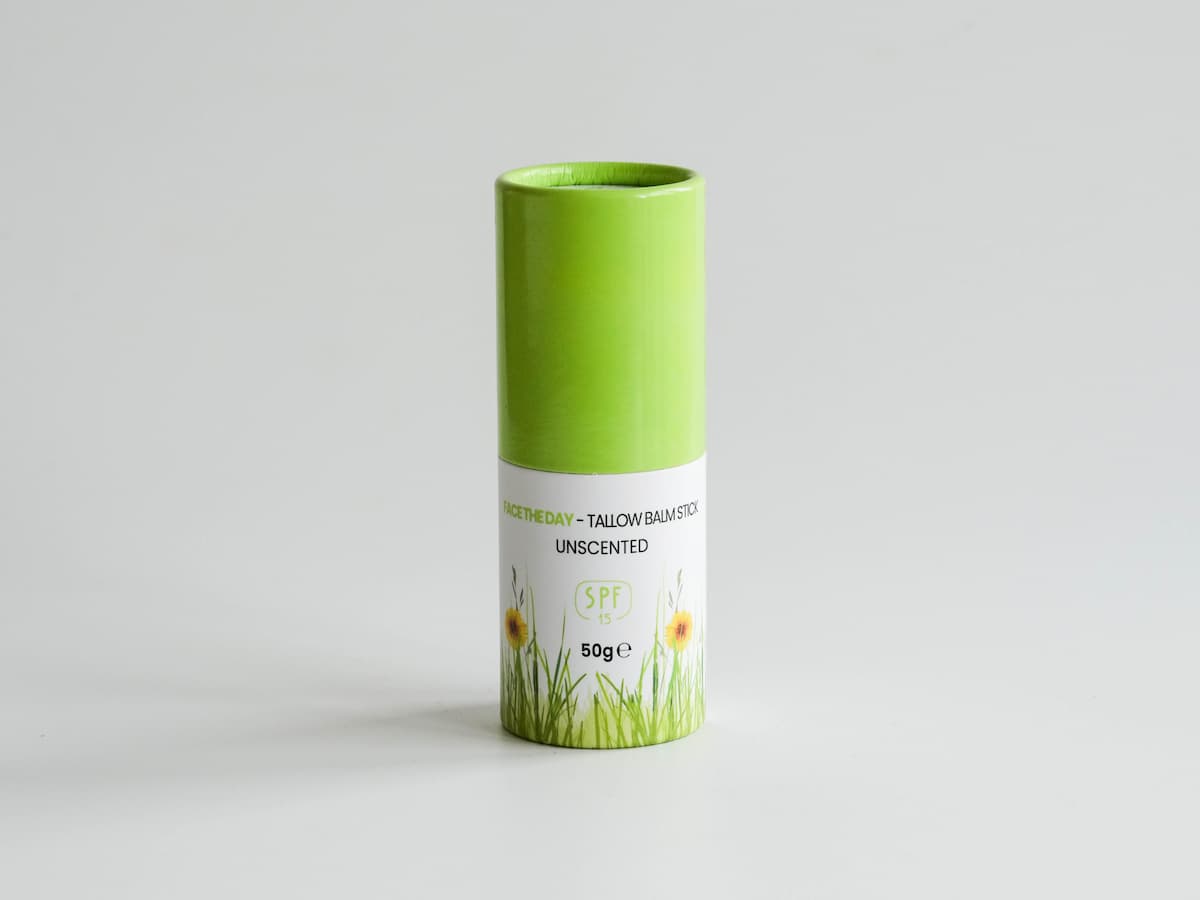Tallow skincare balm stick in eco-friendly packaging with organic ingredients.