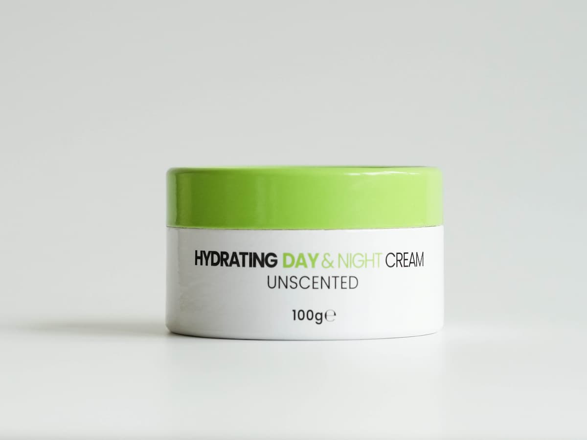 Moisturizing tallow skincare cream in a white and green jar, emphasizing organic and natural ingredi.