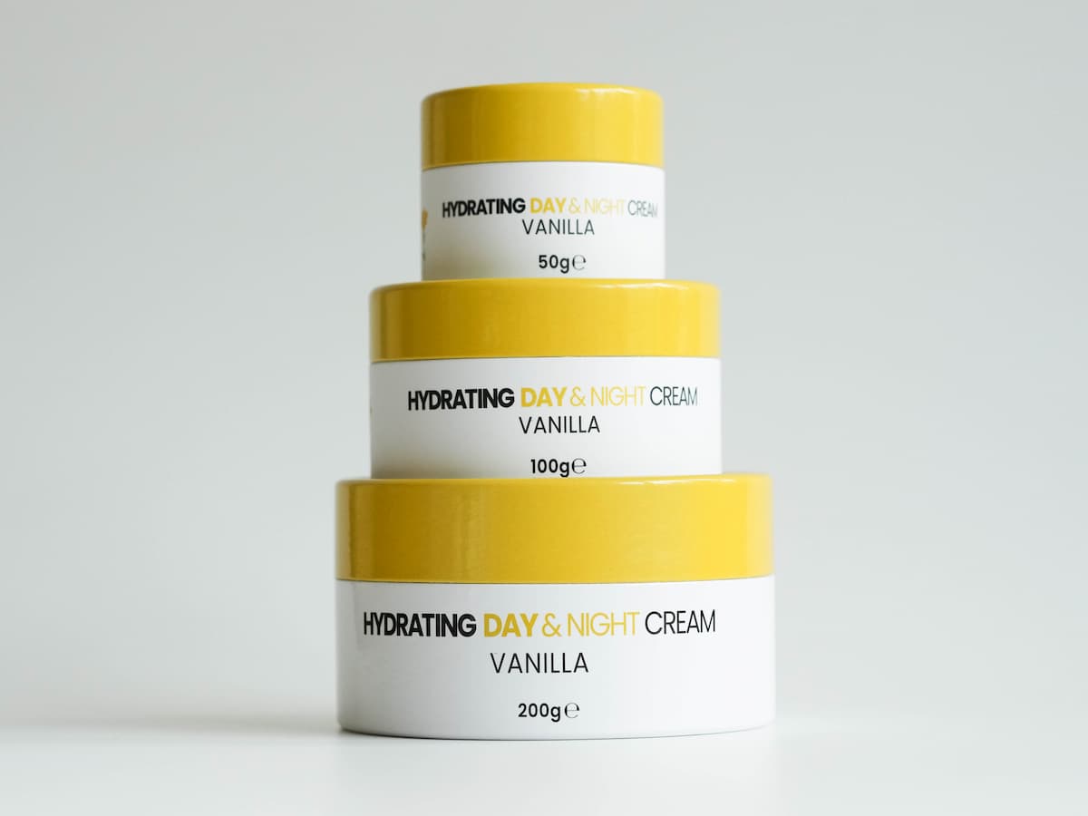 Softening tallow skincare creams in white and yellow containers for organic hydration.