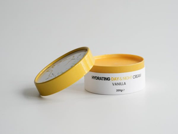 Hydrating tallow skincare cream with vanilla scent in a yellow and white jar.