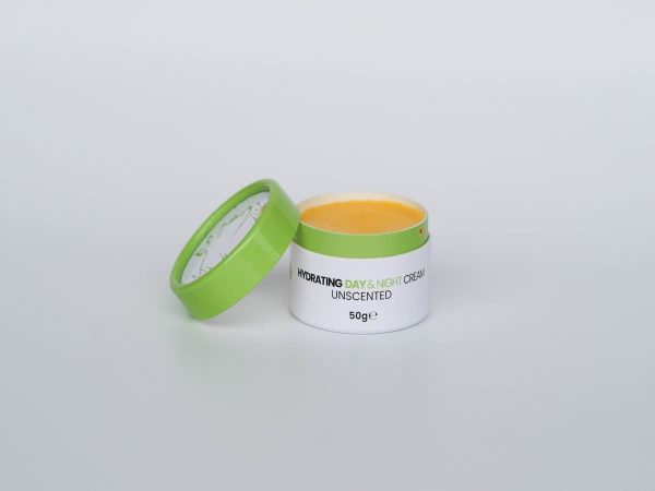 Moisturizing tallow skincare cream in a white jar with a green lid, highlighting organic ingredients.