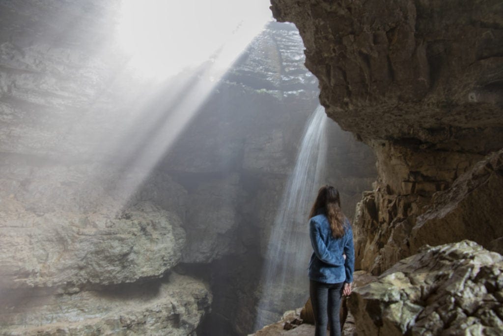 Hiking Stephens Gap Cave in Alabama – Ultimate Guide Taking in all of Stephen's Gap Caves beauty. The light beams and waterfall inside the cave are mesmerizing