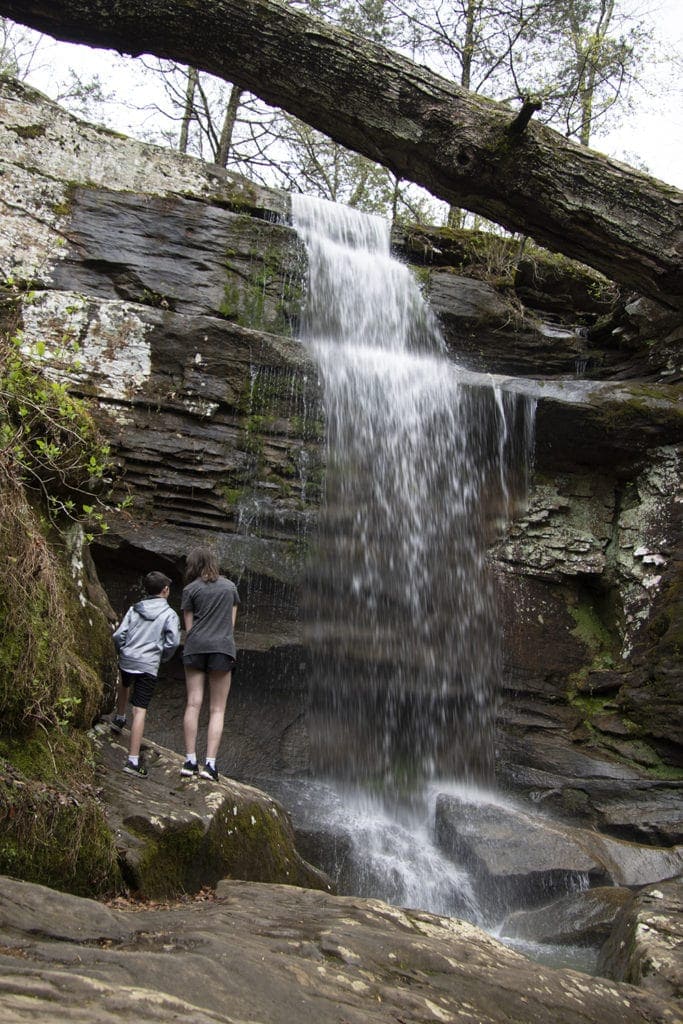Shawnee Review: Top Things to Do in Shawnee National Forest Two kids standing in front of lower Burden Falls in Shawnee National Forest.