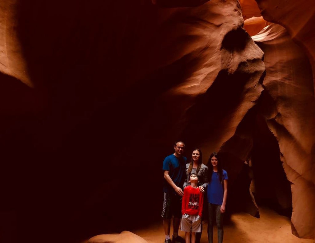 Your Epic 1 to 5 day Zion National Park Itinerary Awaits Family exploring Lower Antelope Canyon: a captivating day trip from Zion National Park. Discovering the beauty of slot canyons and natural wonders together.