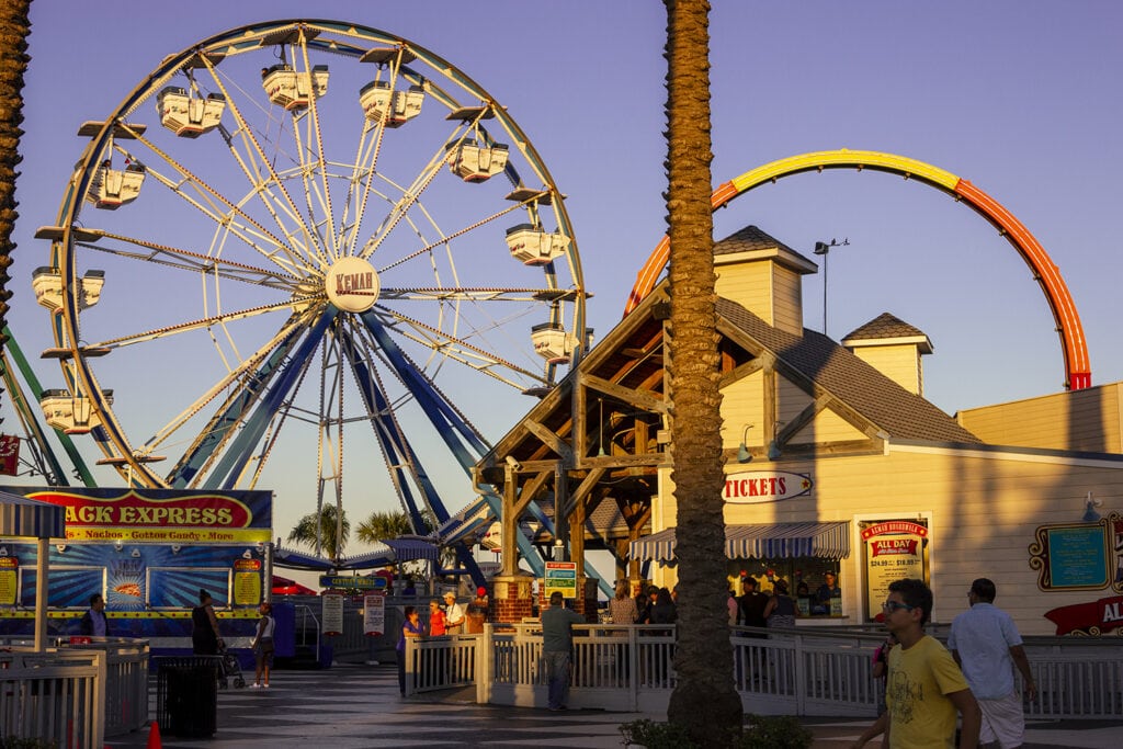 Cheap Spring Break Trips For Families In The U.S. A view of a portion of Kemah Boardwalk in Texas. This shows some of the Amusement Park rides.