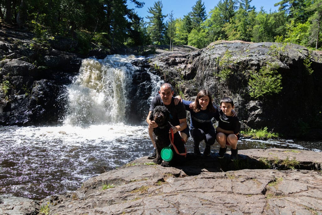 Explore the Natural Beauty of Dead River Falls In Marquette The last and final drop of Dead River Falls in Marquette. A short waterfall surrounded by rocky terrain.