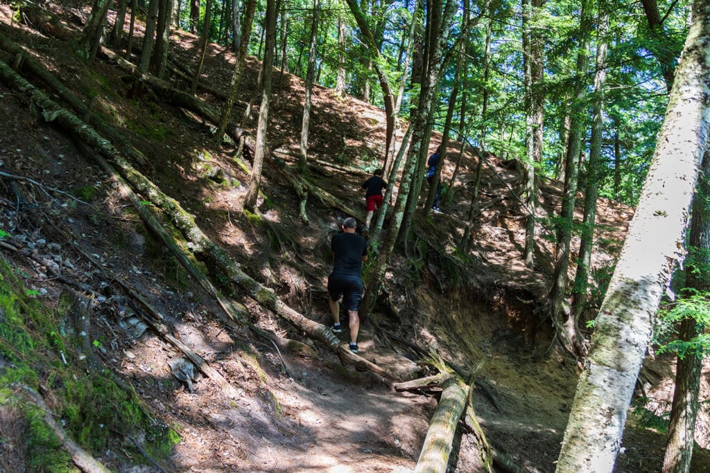 Explore the Natural Beauty of Dead River Falls In Marquette Climbing up the rugged and steep hill.