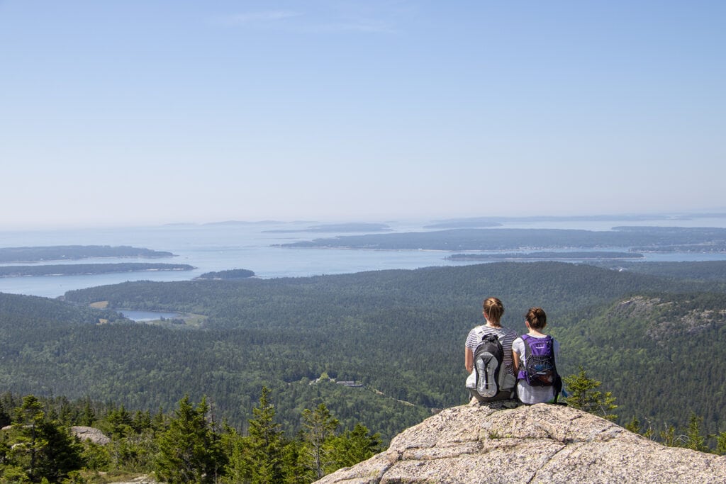 Best Hikes in Acadia National Park + Tips The view from the Pemetic Mountain summit.