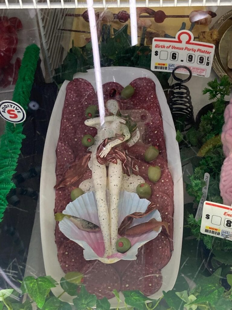 Meow Wolf’s Omega Mart Las Vegas | Ultimate Guide Faux deli meat platter at Omega Mart. Shaped like a person surrounded by anchovies, salami and olives.