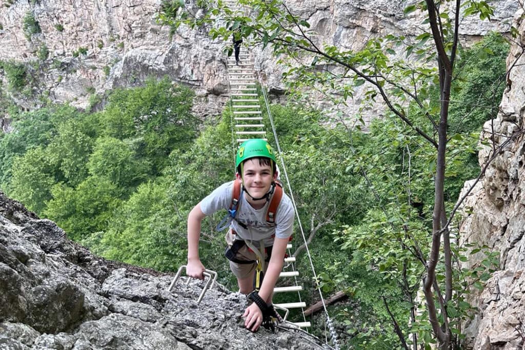 West Virginia Penitentiary: Family Tours Guide 2025 Teen just crossed the suspension bridge at NRocks Via Ferrata