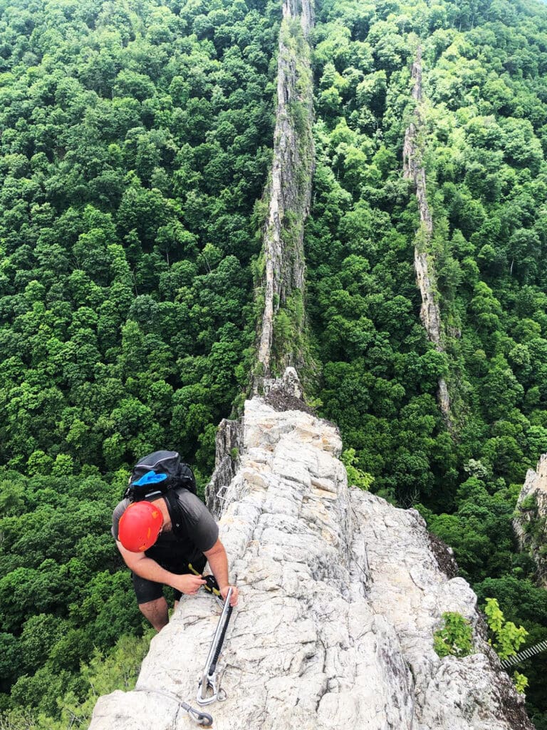 Hiker on top of the optional climb at NRocks Via Ferrata 