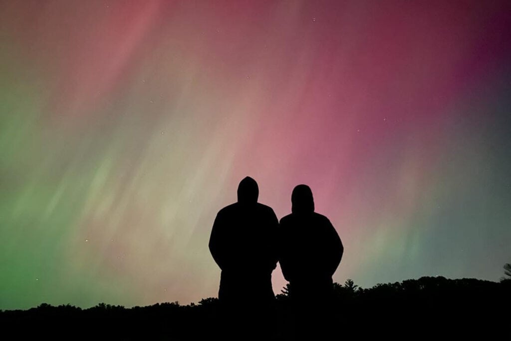 Where to See Northern Lights in Michigan: Upper & Lower Peninsula Image of northern lights in Grand Haven, one of the top spots where to see northern lights in Michigan.