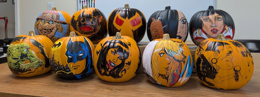 Colorful painted pumpkins supporting Hero Initiative charity event.