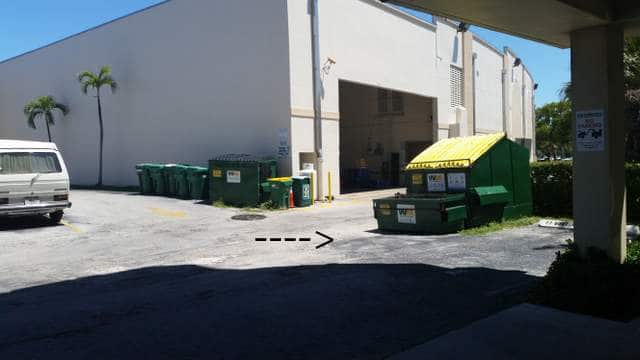 rod sticking out of the ground in parking lot- facing East
