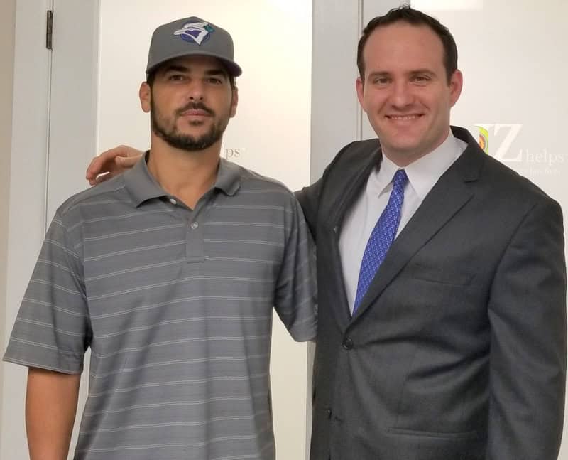 Attorney Justin "JZ" Ziegler, and car accident victim client
