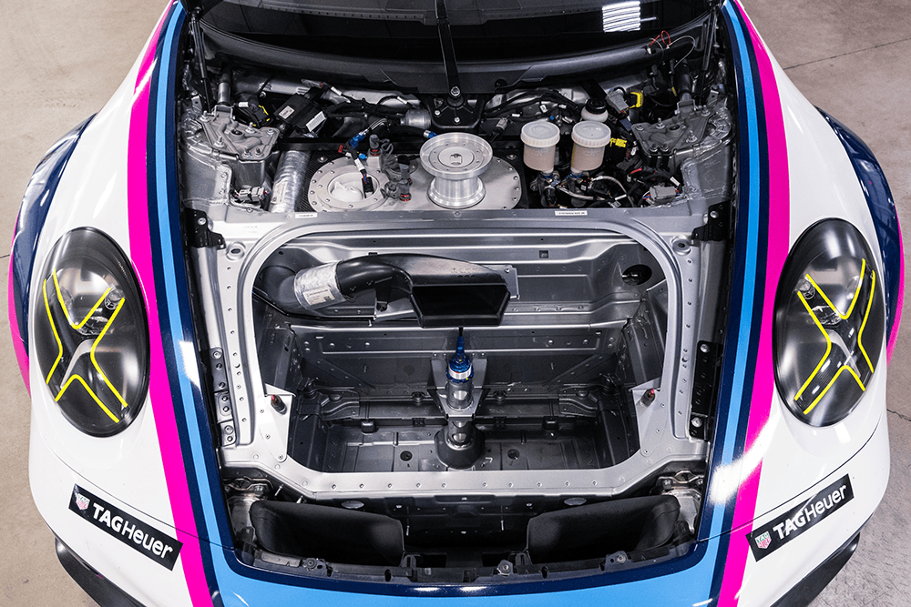 Close-up of the engine bay of a 2022 Porsche 911 Cup Car 992.