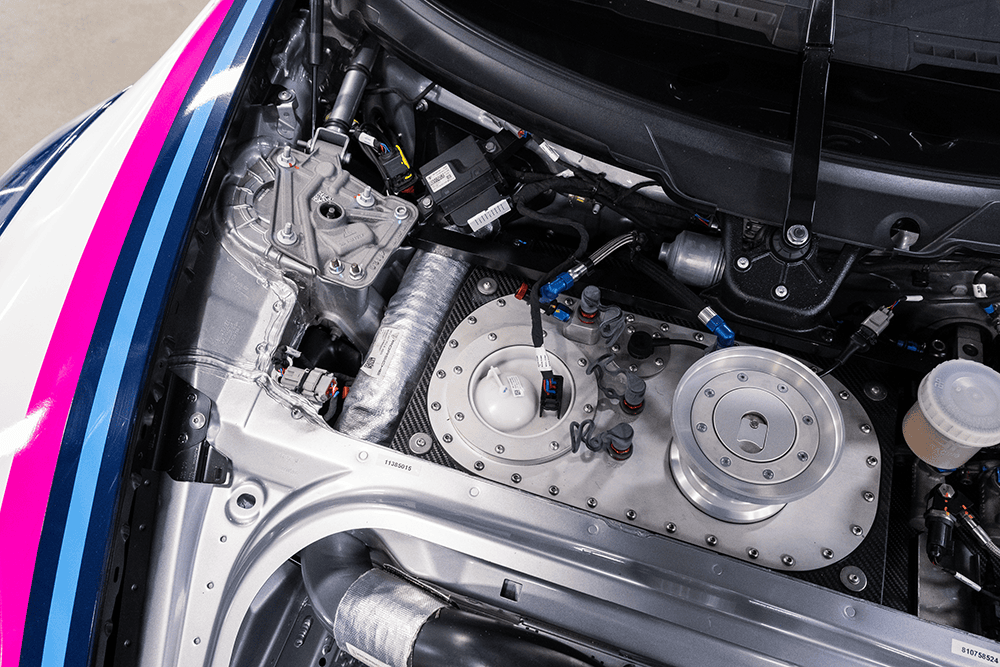 Close-up of Porsche 911 Cup Car 992 engine and mechanical components.
