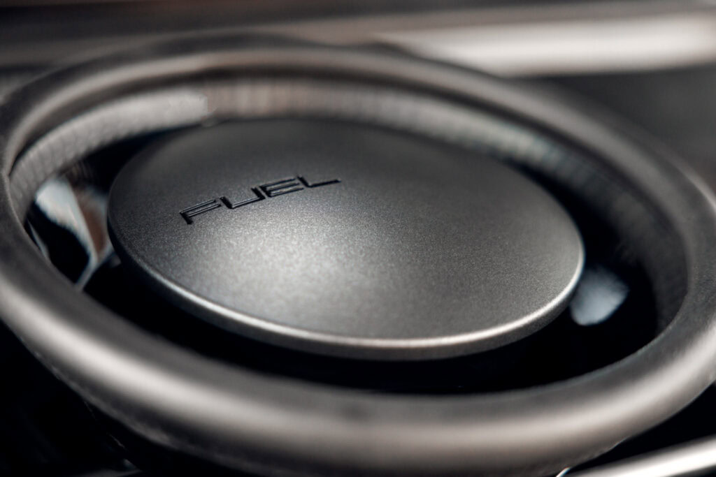 Close-up of Porsche 964 fuel cap with Kellymoss branding.