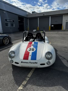 Vintage Brumos Porsche race car with number 36 and racing stripes.