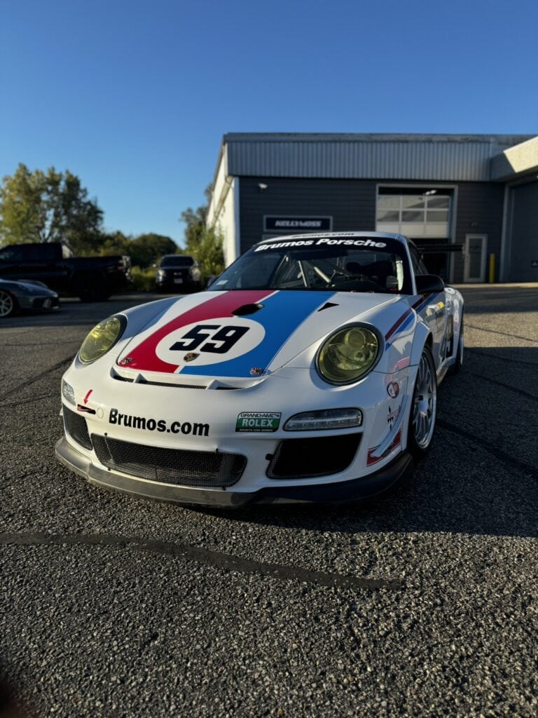 Kellymoss Porsche 997 Cup race car with racing livery and number 59.
