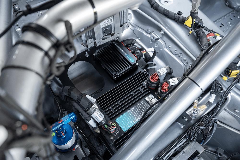 Close-up of the Porsche 911 GT3 Cup 992 engine and components.