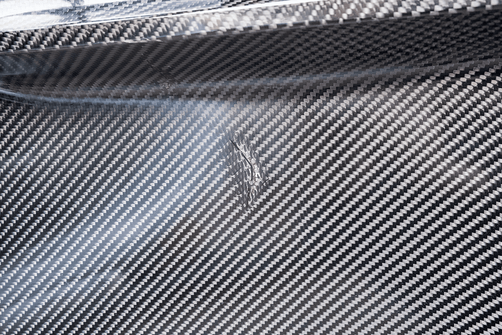 Close-up of carbon fiber surface on Porsche 911 GT3 Cup.
