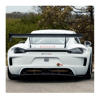 White Kellymoss GT4R race car with rear wing on a track.
