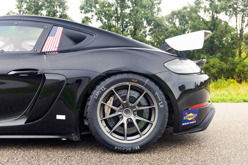 Black 2025 GT4 Clubsport RS race car with aerodynamic features.