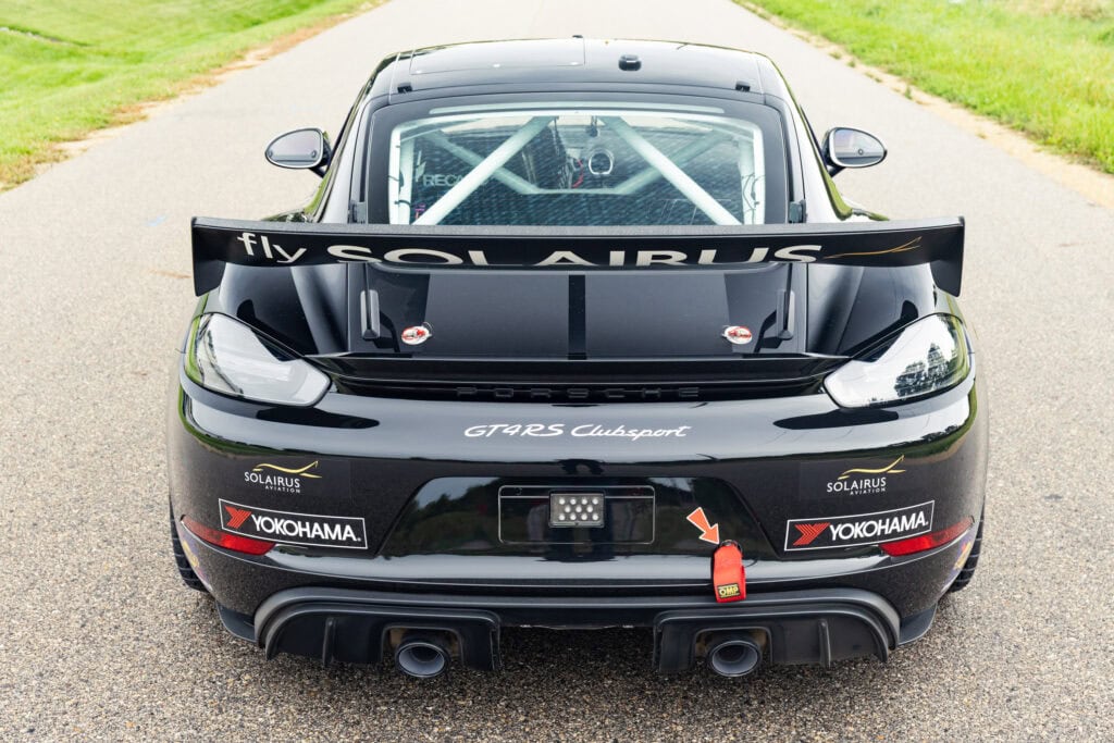 Black 2025 GT4 Clubsport RS race car with aerodynamic features.