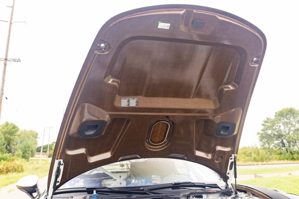 Open hood of a 2025 GT4 Clubsport RS showing engine components.