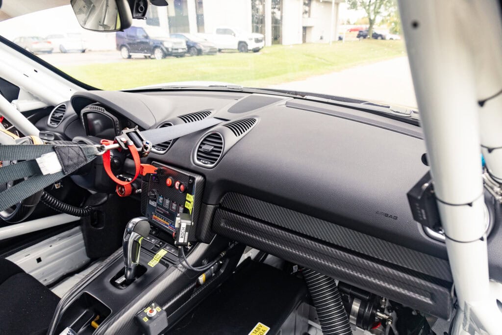 Racing car interior with dashboard and safety harness for Kellymoss 2025 GT4 Clubsport RS.