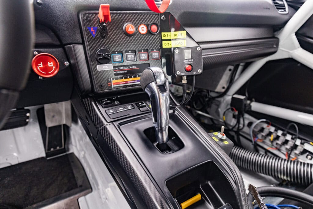 Race car interior with gear shifter and control panel for Kellymoss.