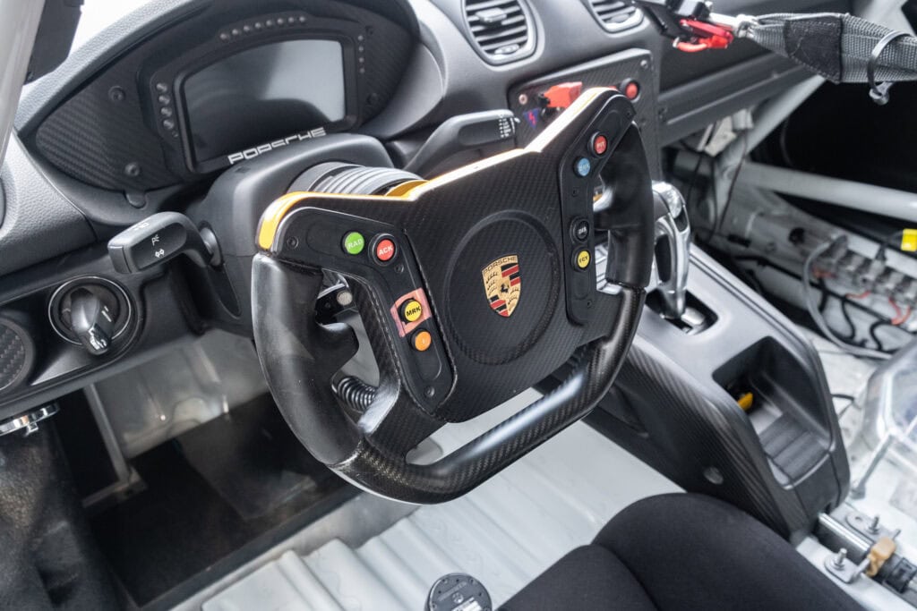 Close-up of racing steering wheel in Porsche 911 GT4 Clubsport RS.