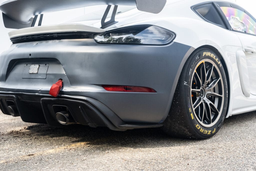 Close-up of the rear of a 2023 GT4 Clubsport RS race car with Pirelli tires.