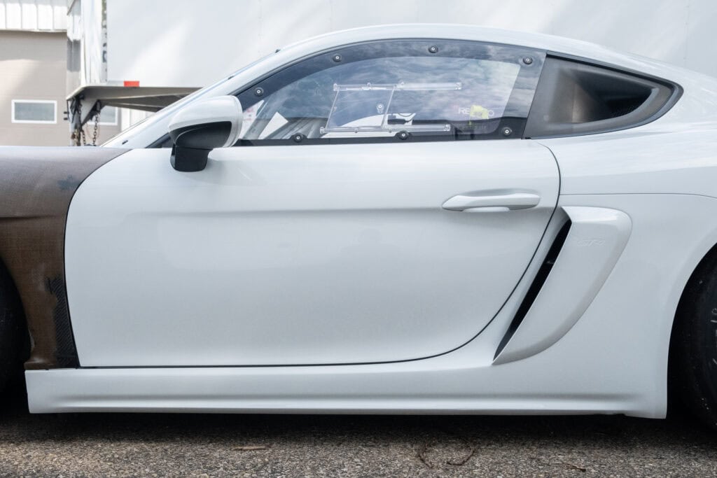 Close-up of a white 2023 GT4 Clubsport RS race car by Kellymoss.