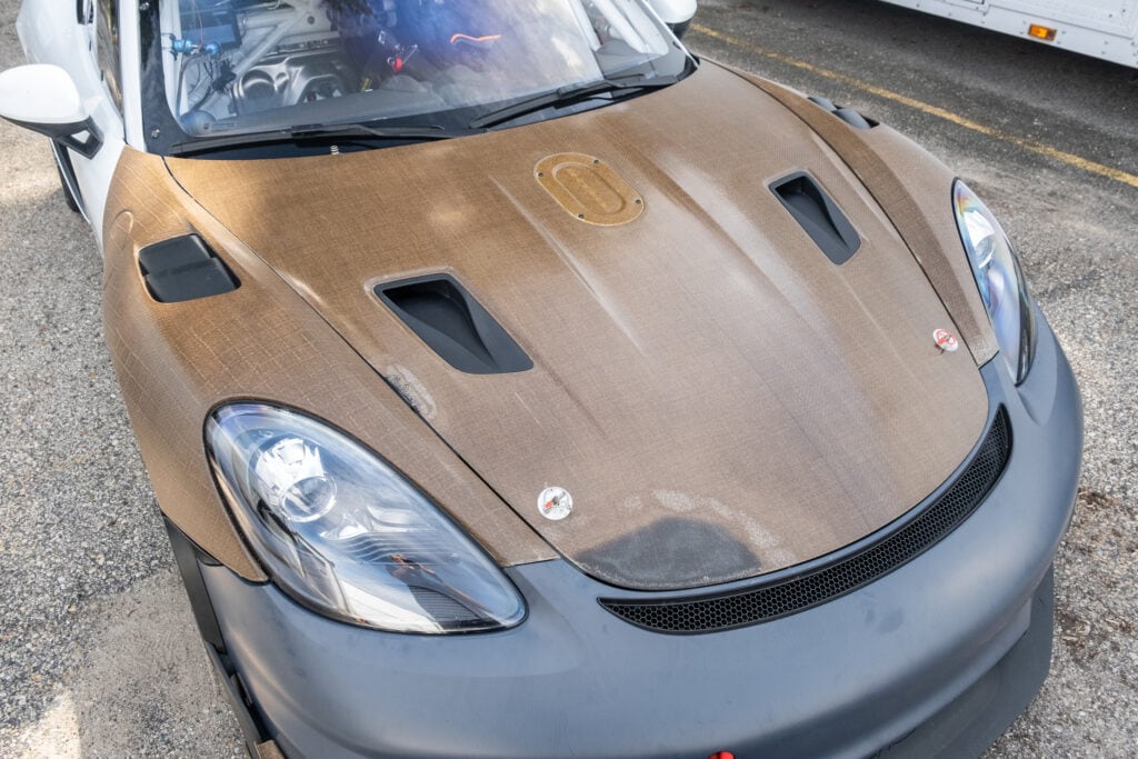 Close-up of a Kellymoss 2023 GT4 Clubsport RS race car with carbon fiber hood.