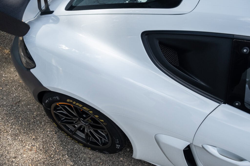 Close-up of the front of a white 2023 GT4 Clubsport RS with black accents.