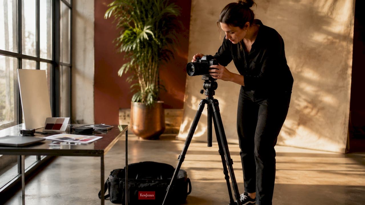 Photographer working in a bright daylight studio